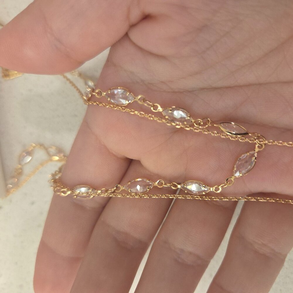 white and gold necklace with rectangle pendant